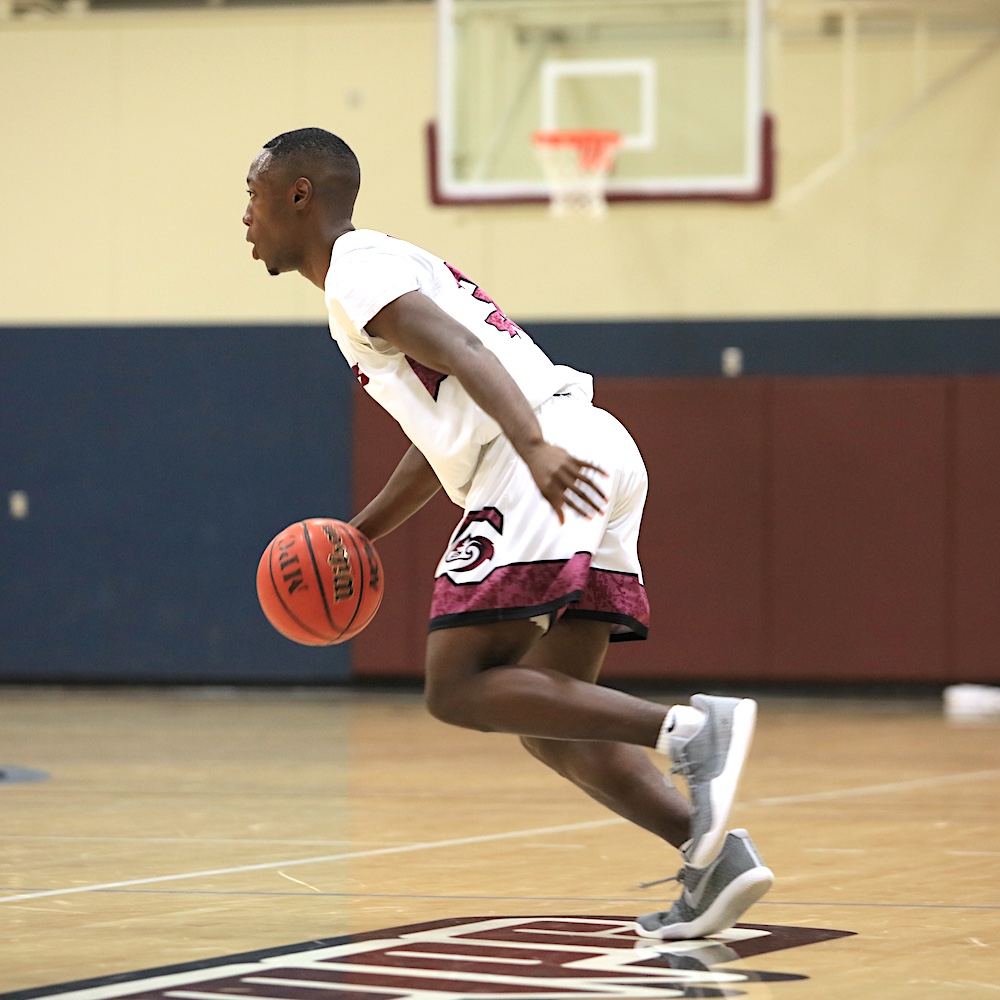 MPC Basketball Player Dribbling Ball in Campus Gymnasium