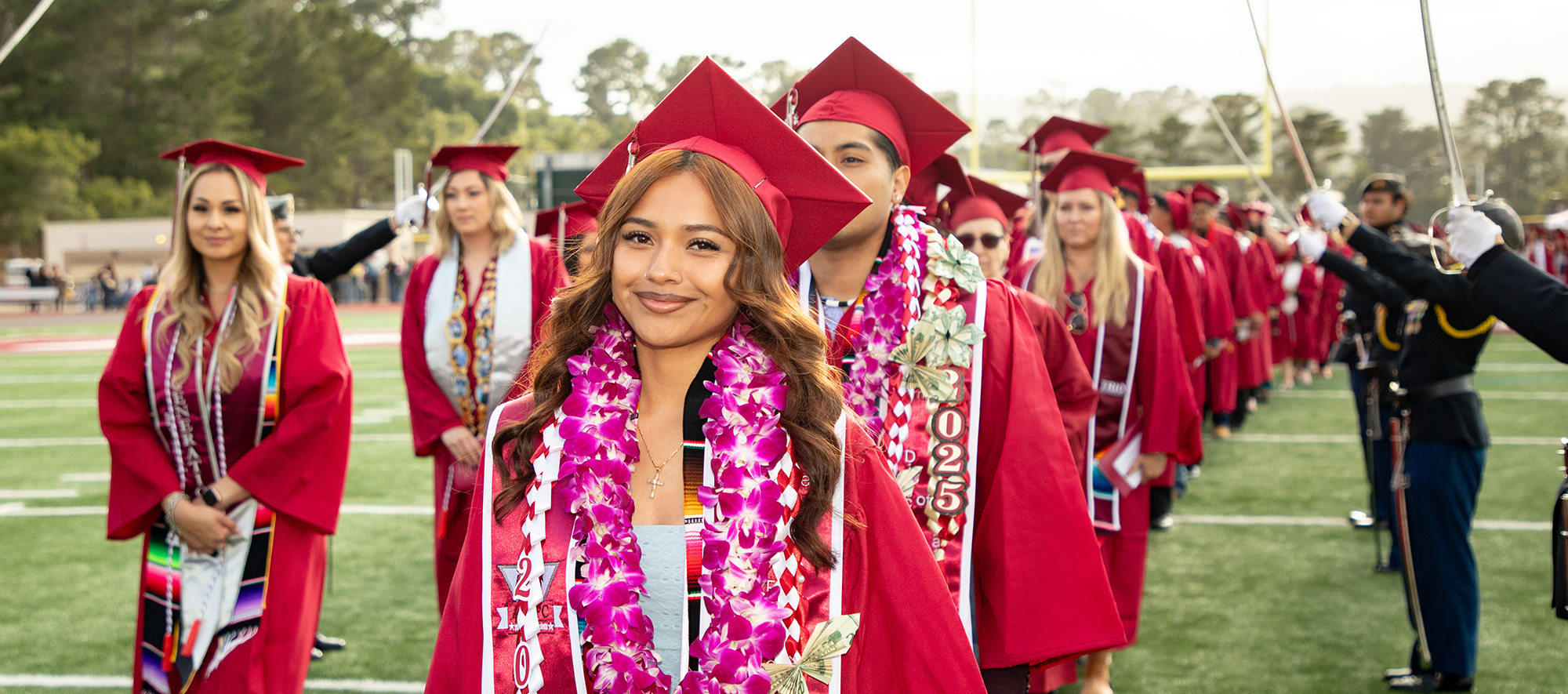 Students entering field on graduation day