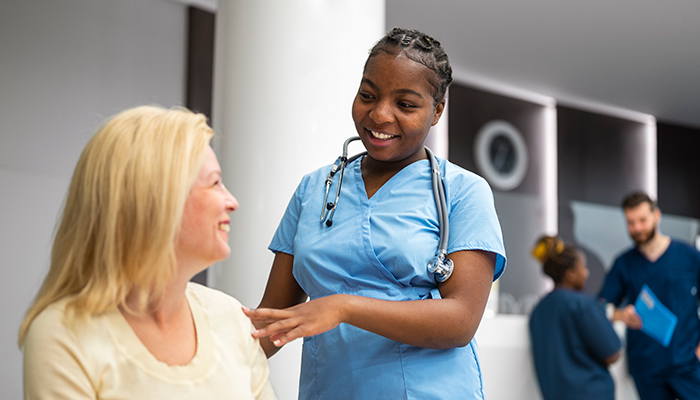 Health Professional talks to a patient