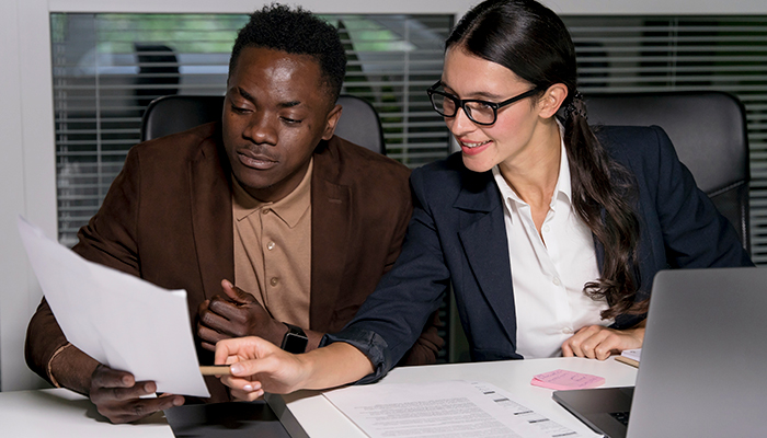 Business coworkers discuss project in an office