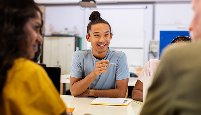 College students working on a group project in a speech class