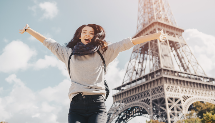 Happy college student studying in France