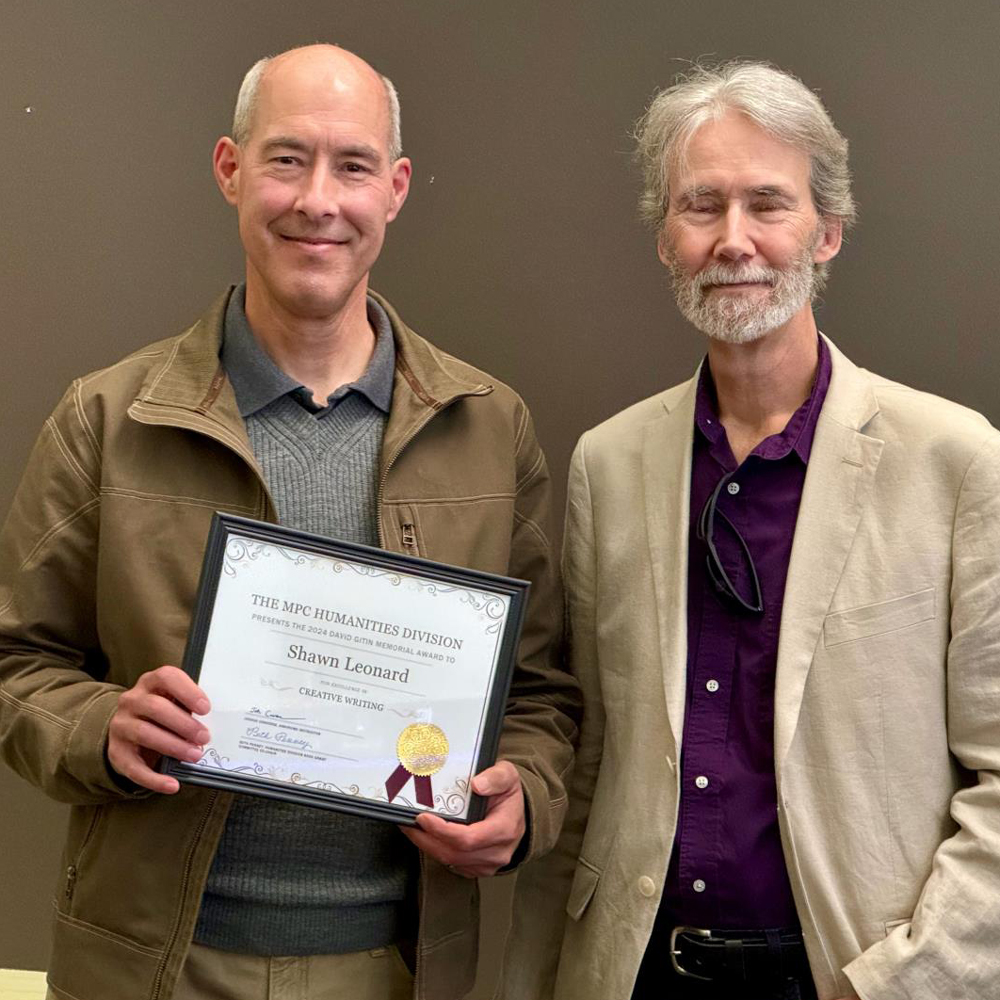 Shawn Leonard pictured with Creative Writing program coordinator Henry Marchang