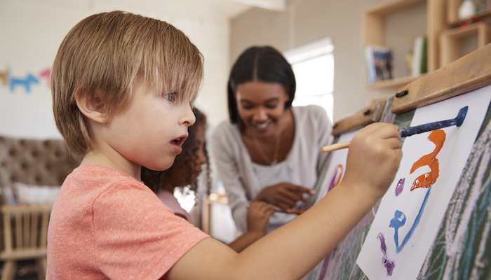 Young Child Painting in Class