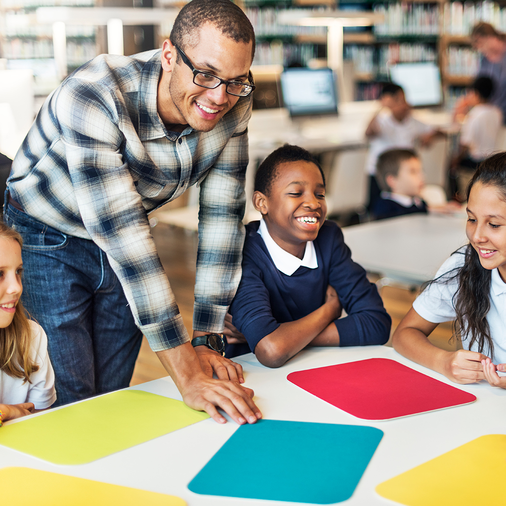 Teacher working with students at an elementary school