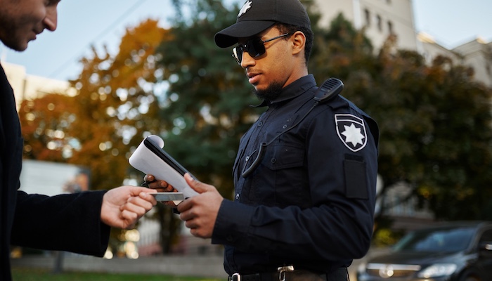 Police Officer Issuing Traffic Ticket