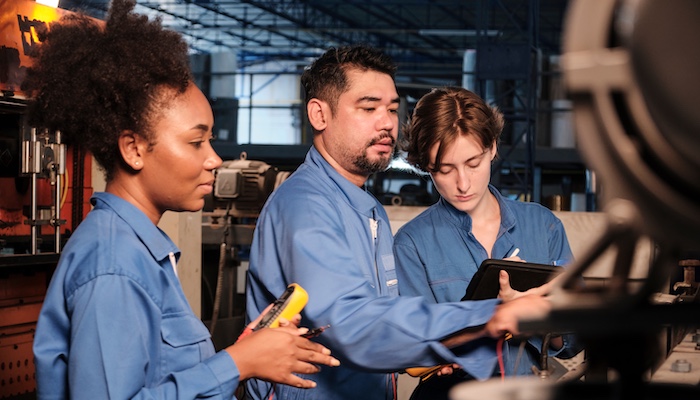 Three Mechanical Engineers Working Together