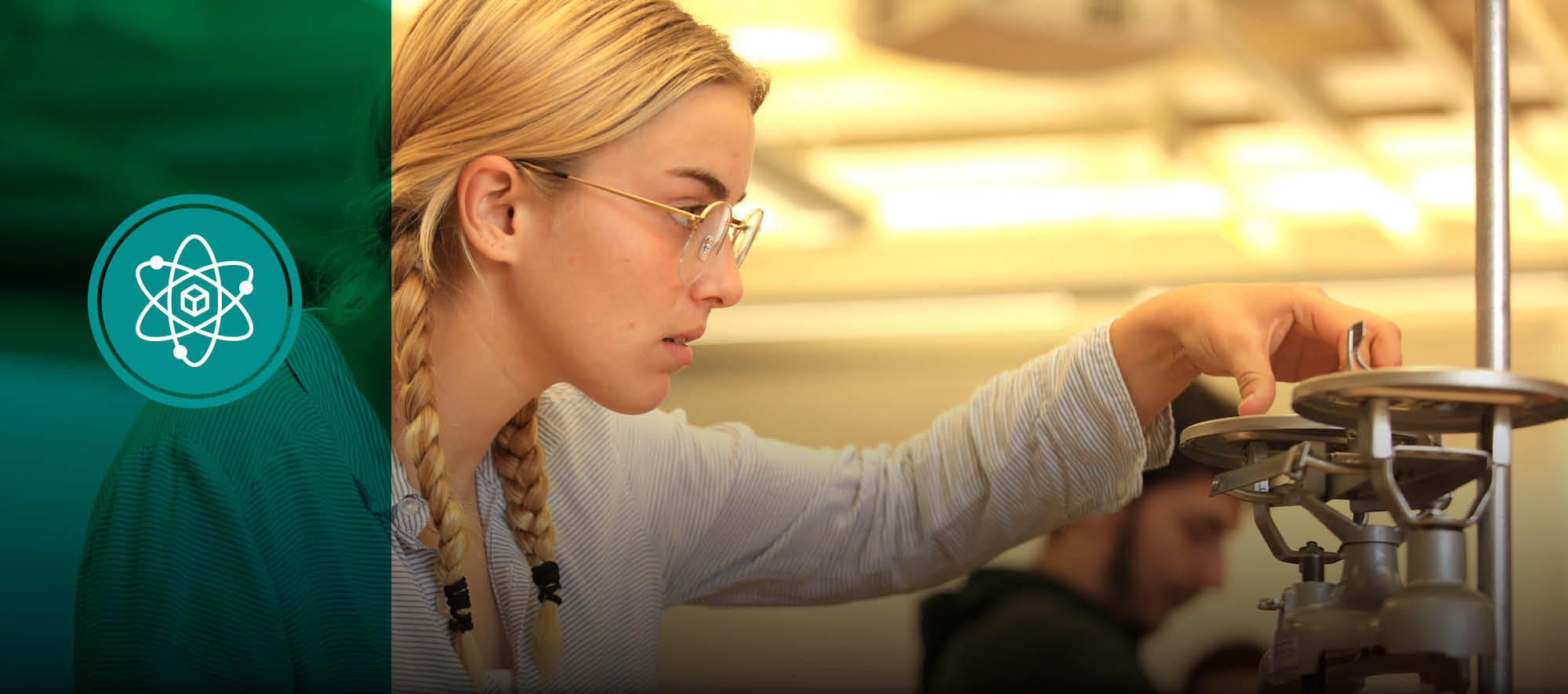 female physics student works on a problem in the lab