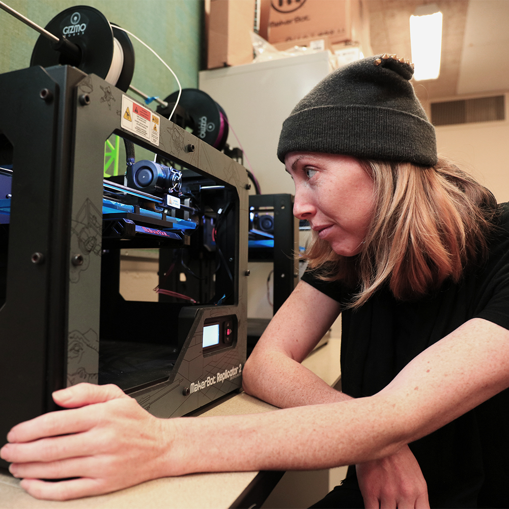 MPC student watches project print during 2D Arts & Technology class