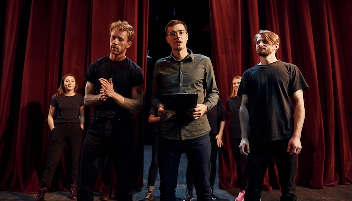 Three Performers Practicing Acting in Theatre Class