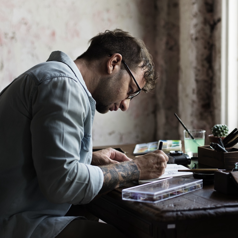 Man writing in journal