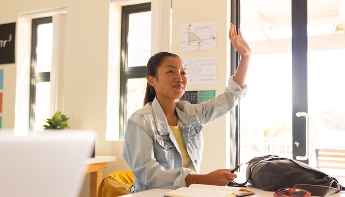 Student Raising Hand in Classroom