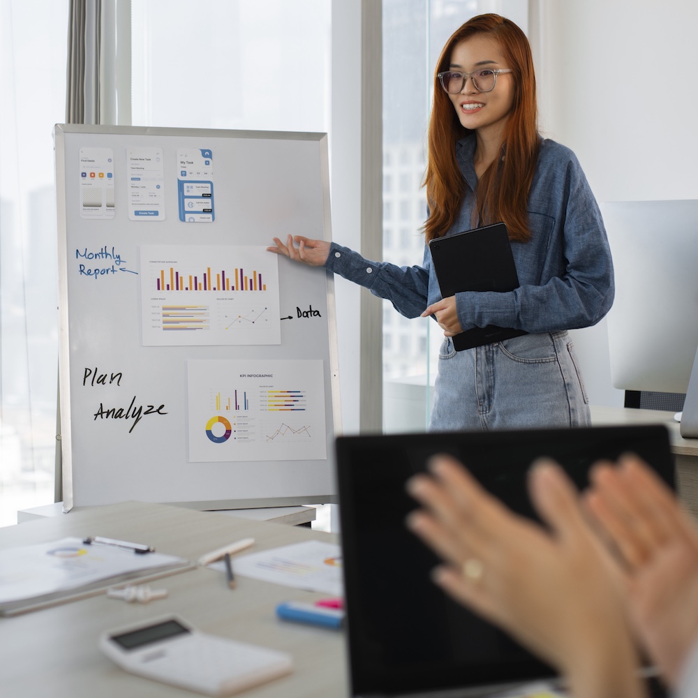 Marketing Specialist Giving Presentation to Office