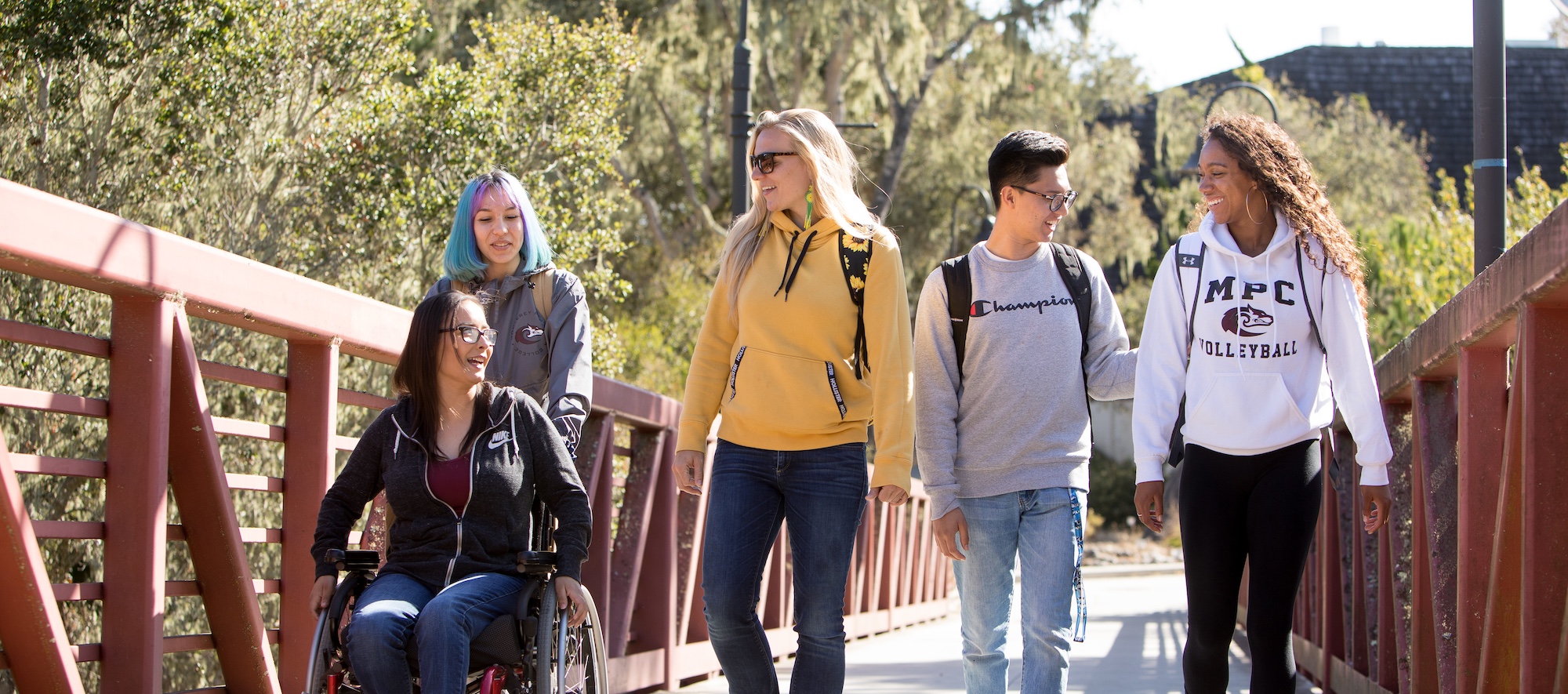 MPC Students crossing campus bridge