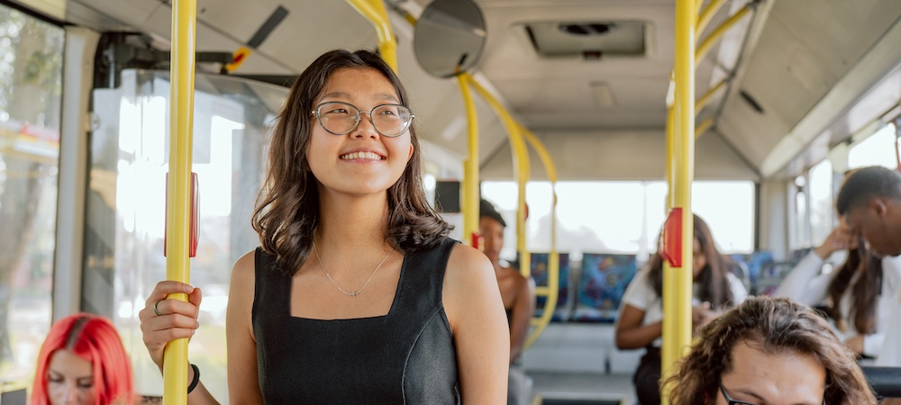 Student Smiling on Bus