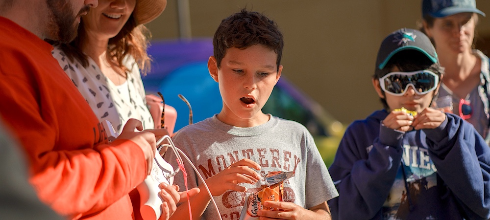 Children Eating and Participating in Famliy STEM Day