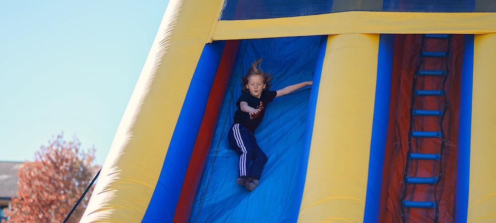 Child on Jumpy Slide at Family STEM Day