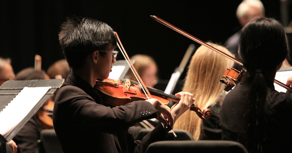 Student Playing Violin in MPC String Ensemble Concert