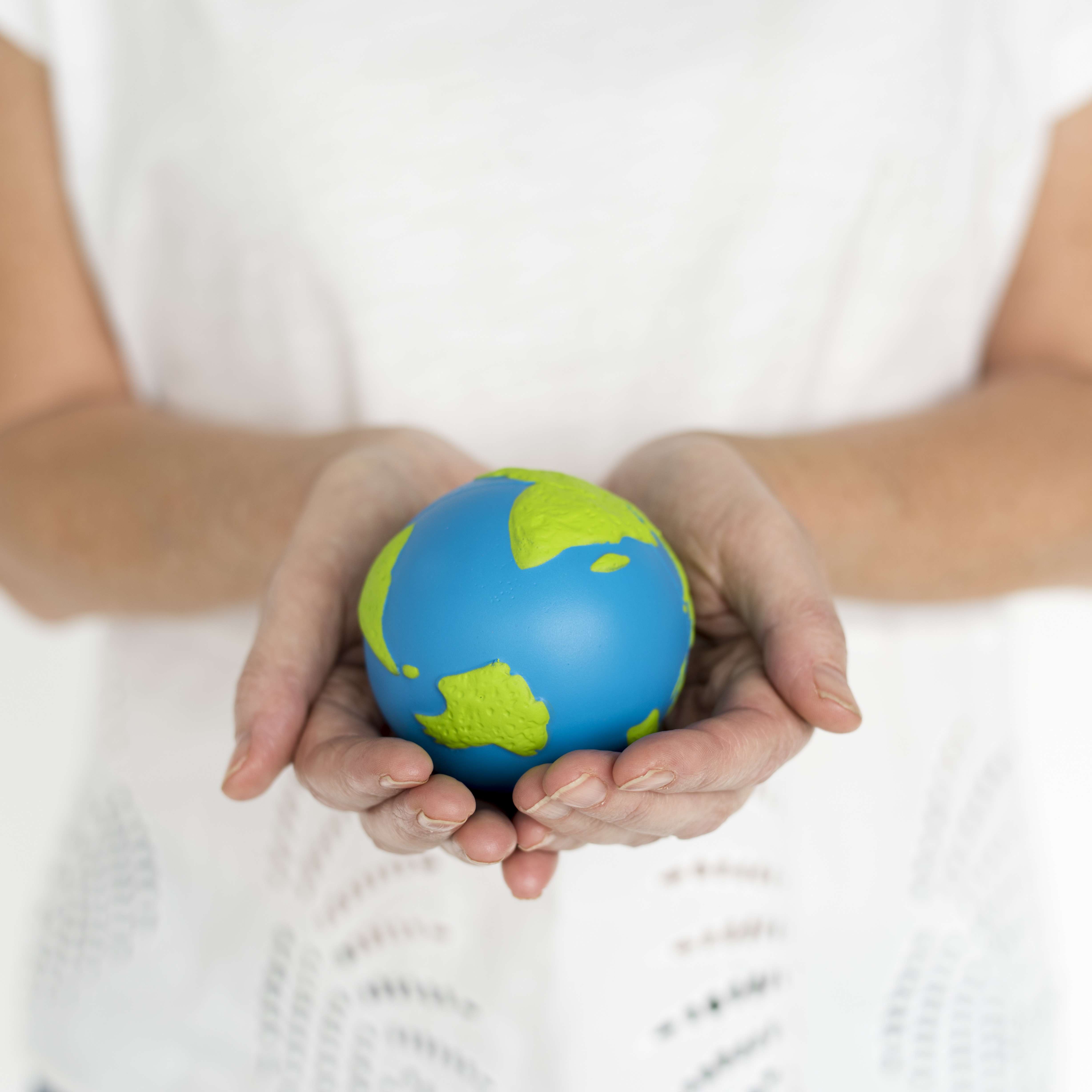 Hands Holding Small Earth Globe