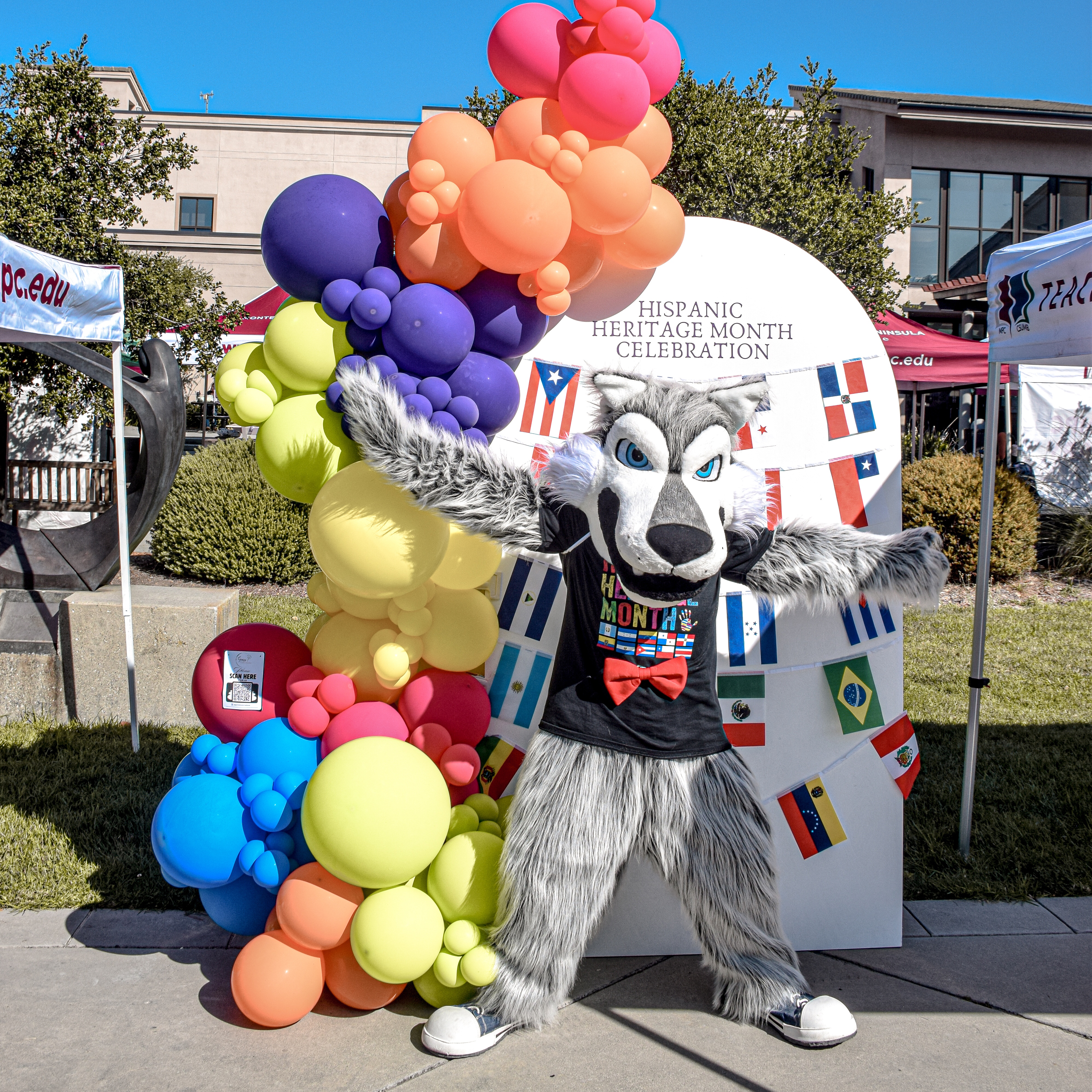 Louie the Lobo Posing in Front of Balloons at Hispanic Heritage Month Celebration