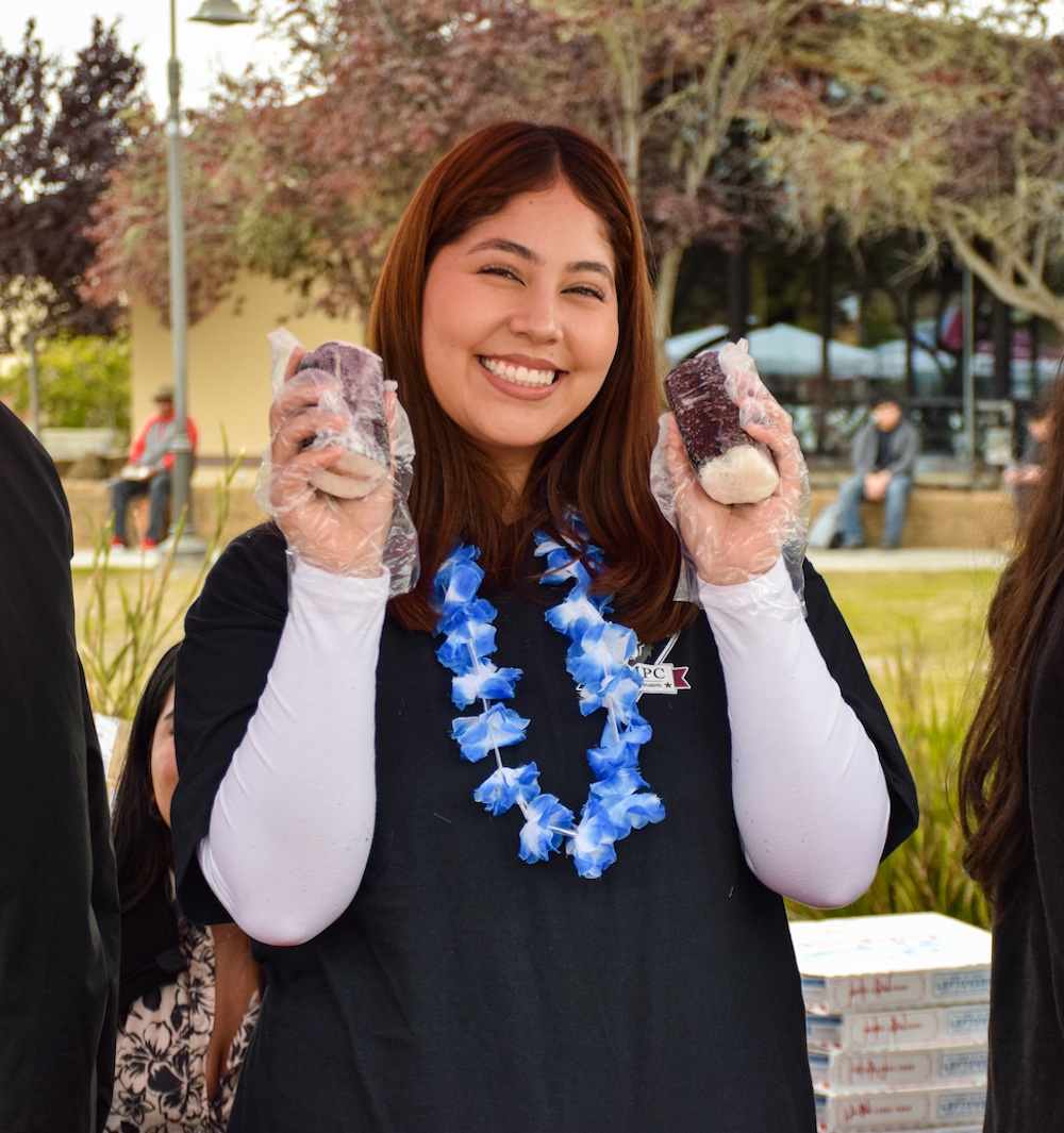 ASMPC Member Holding Up Spam Musubis