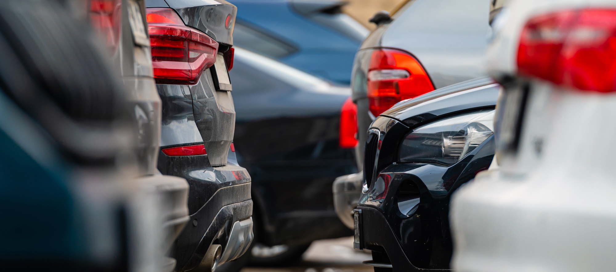 Parked Cars Lined Up in Parking Lot