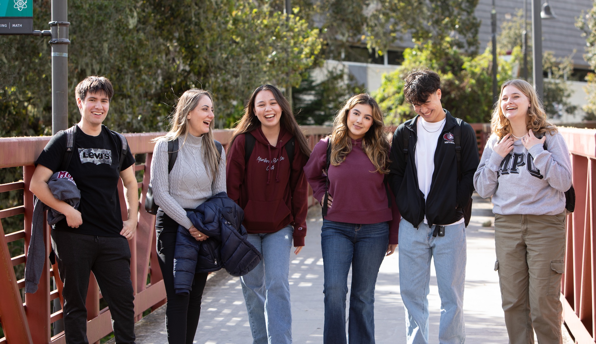 Students walking across the bridge