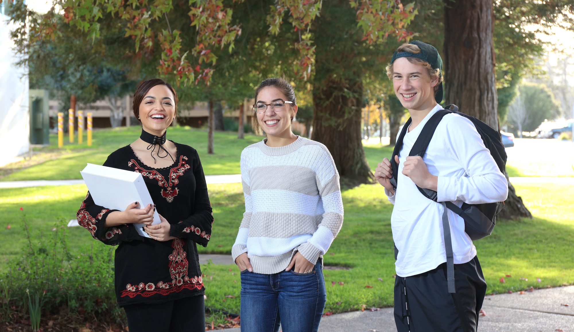 three mpc students walking on monterey campus together