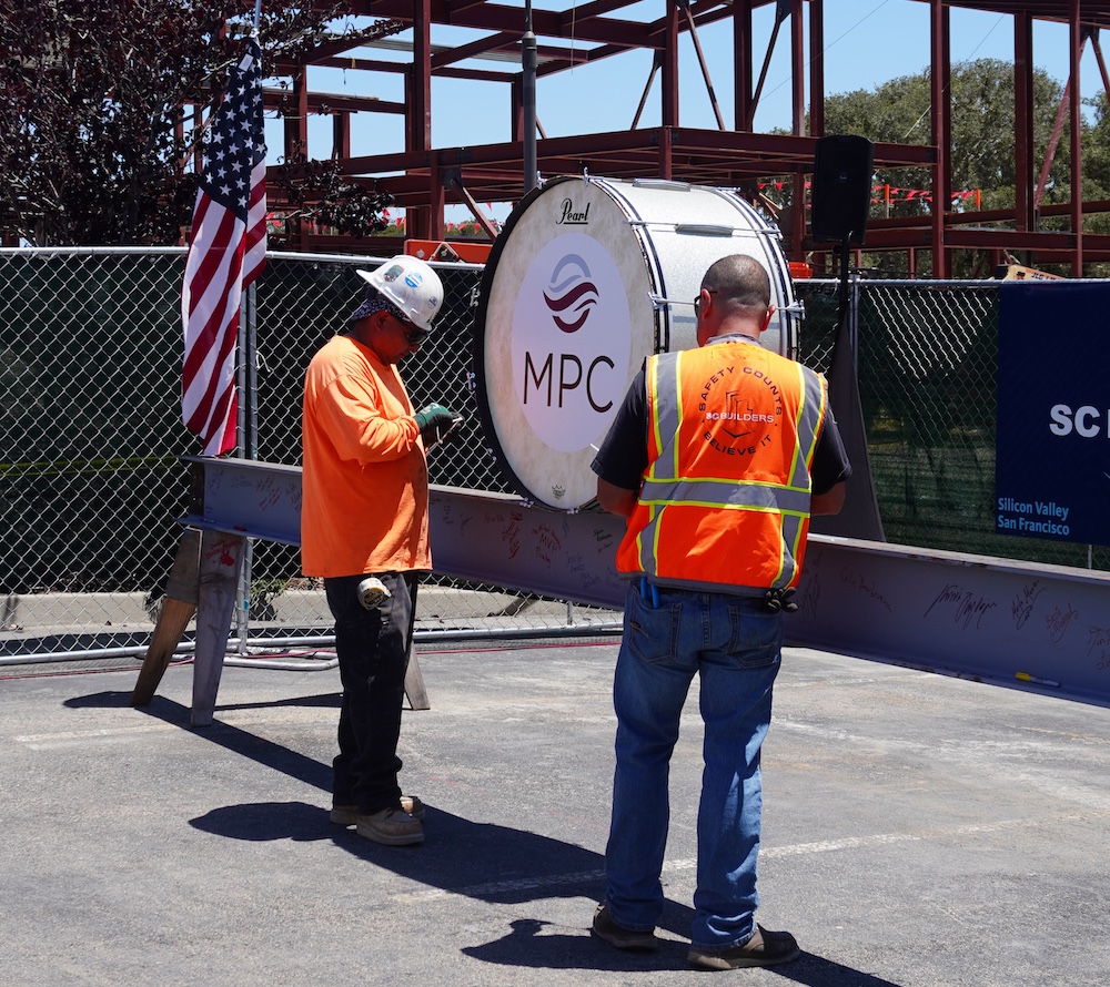 Construction Workers Preparing to Lift Beam into Place