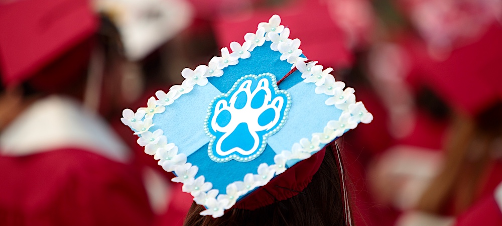 mpc graduate with decorated cap