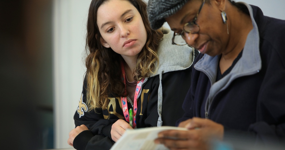 Two people reading together