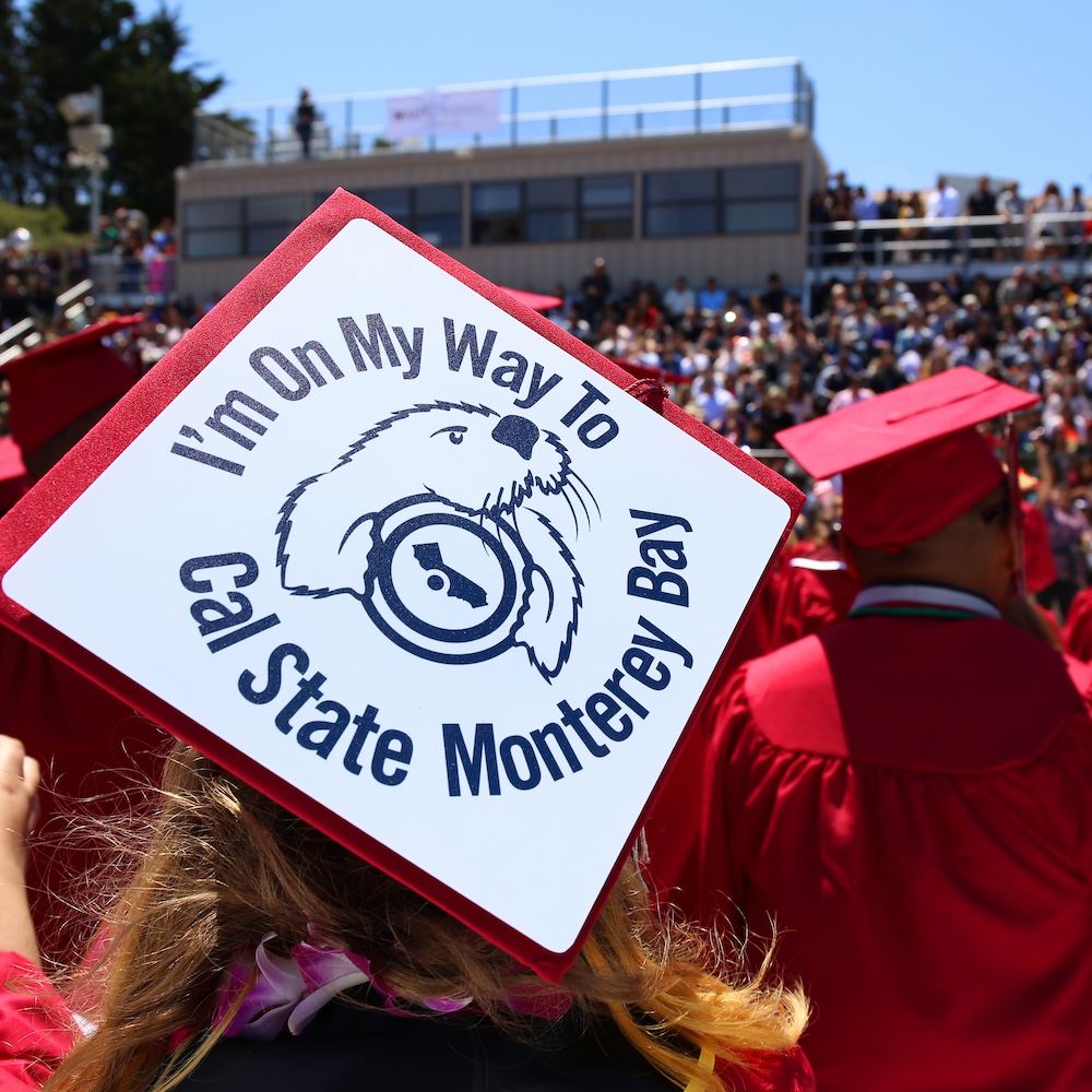 Student with Graduation Cap That Says "I'm on my way to Cal State Monterey Bay"