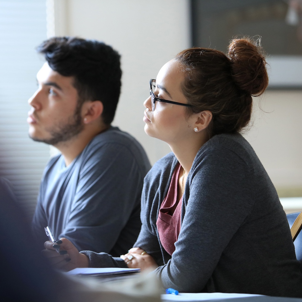 Two students listening to skills workshop